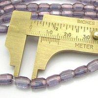 7mm Faceted Oval Beads, Amethyst AB Czech Glass Fire Polished Barrels