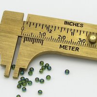 11/0 Seed Beads, Round TOHO Olivine Rainbow, Translucent Iridescent Green Spacers