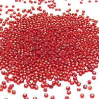 8/0 seed beads are translucent red mini rocailles with a gold foil lining. Beads average 2.5x3.5mm with round 1.0mm holes. There are approximately 38-40 beads per gram.