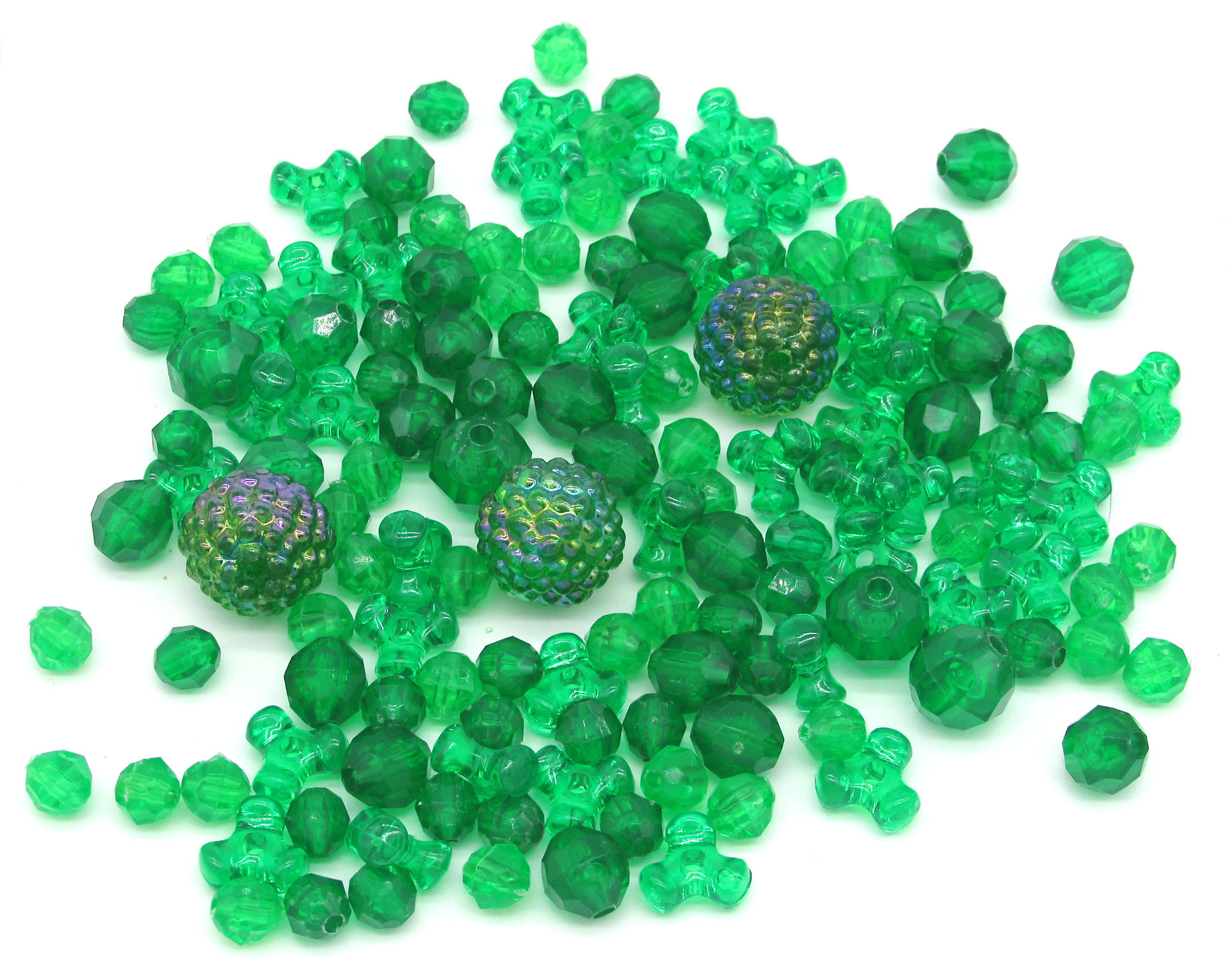 Green plastic bead mix has 145 rounds and tri-beads. Sizes range from 6mm to 15mm.