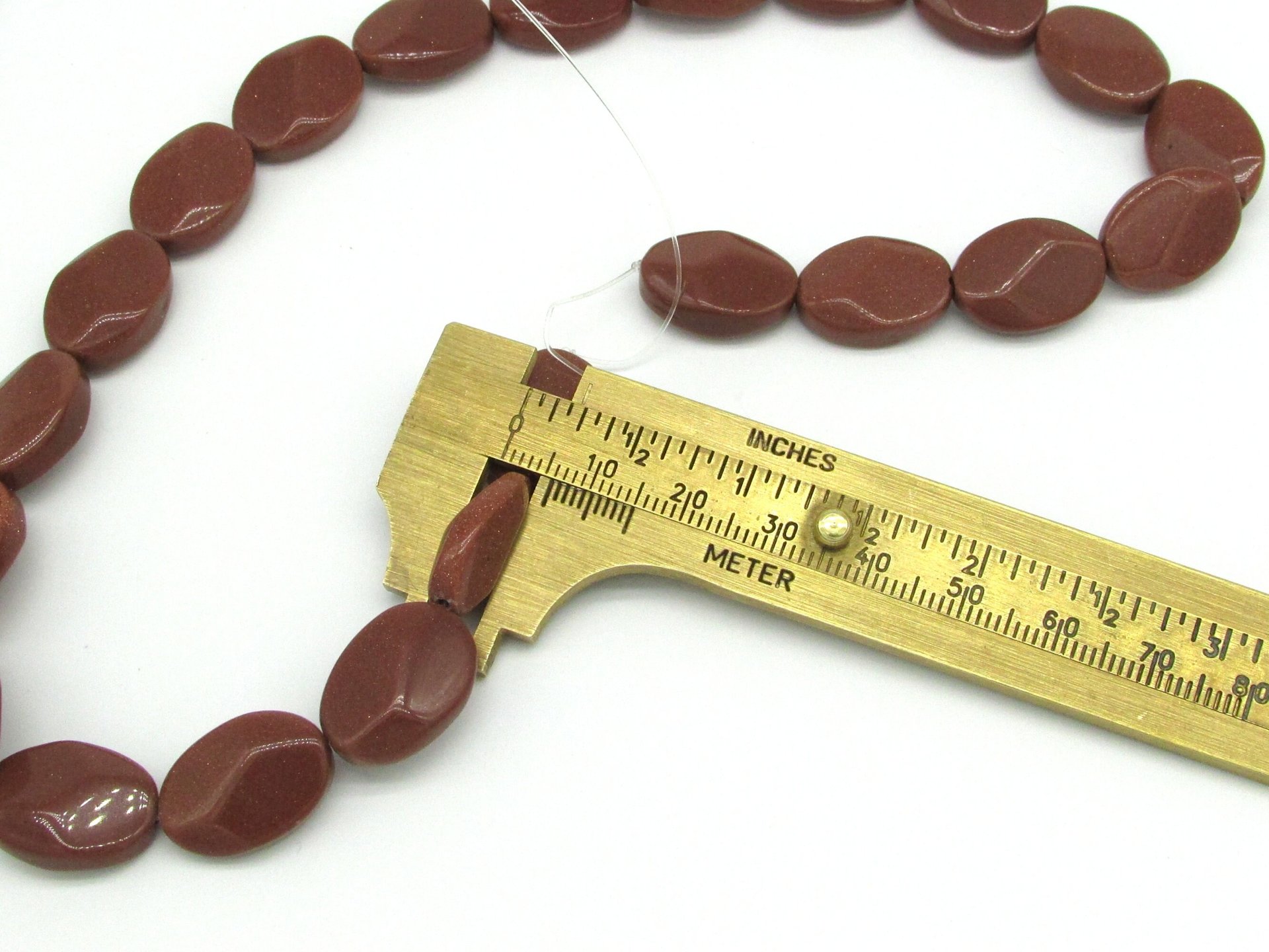 18mm Flat Oval Beads, Faceted Goldstone