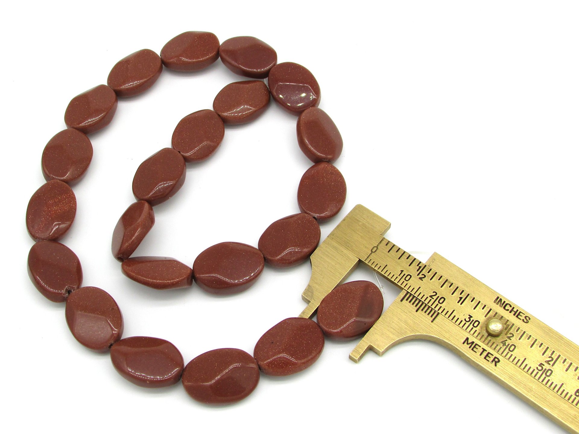 18mm Flat Oval Beads, Faceted Goldstone