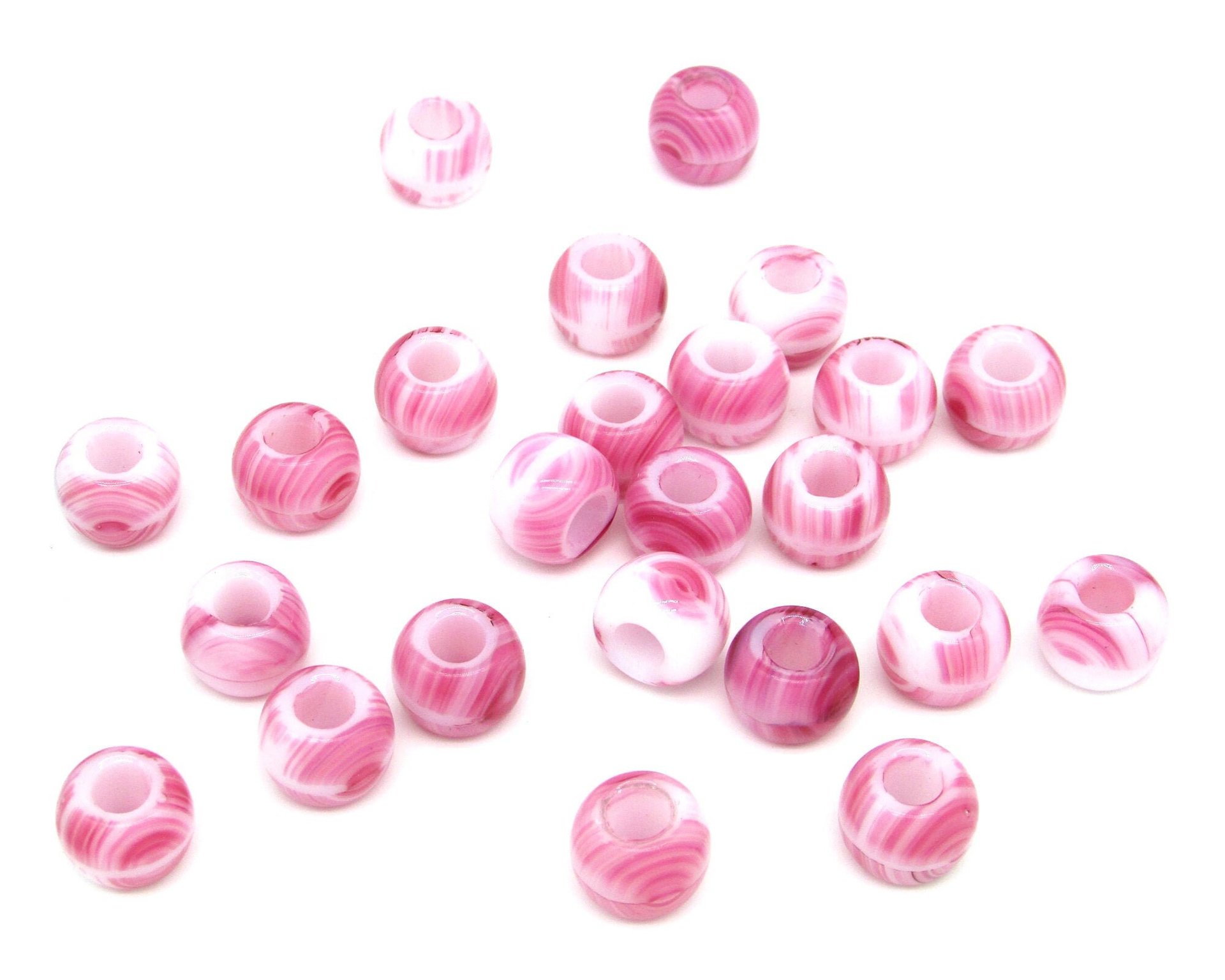 Chubby roller beads measure 9.5mm long by 12mm diameter with 5mm center holes. These Czech glass large hole rondelles are opaque white, striped and swirled randomly with dark pink. 