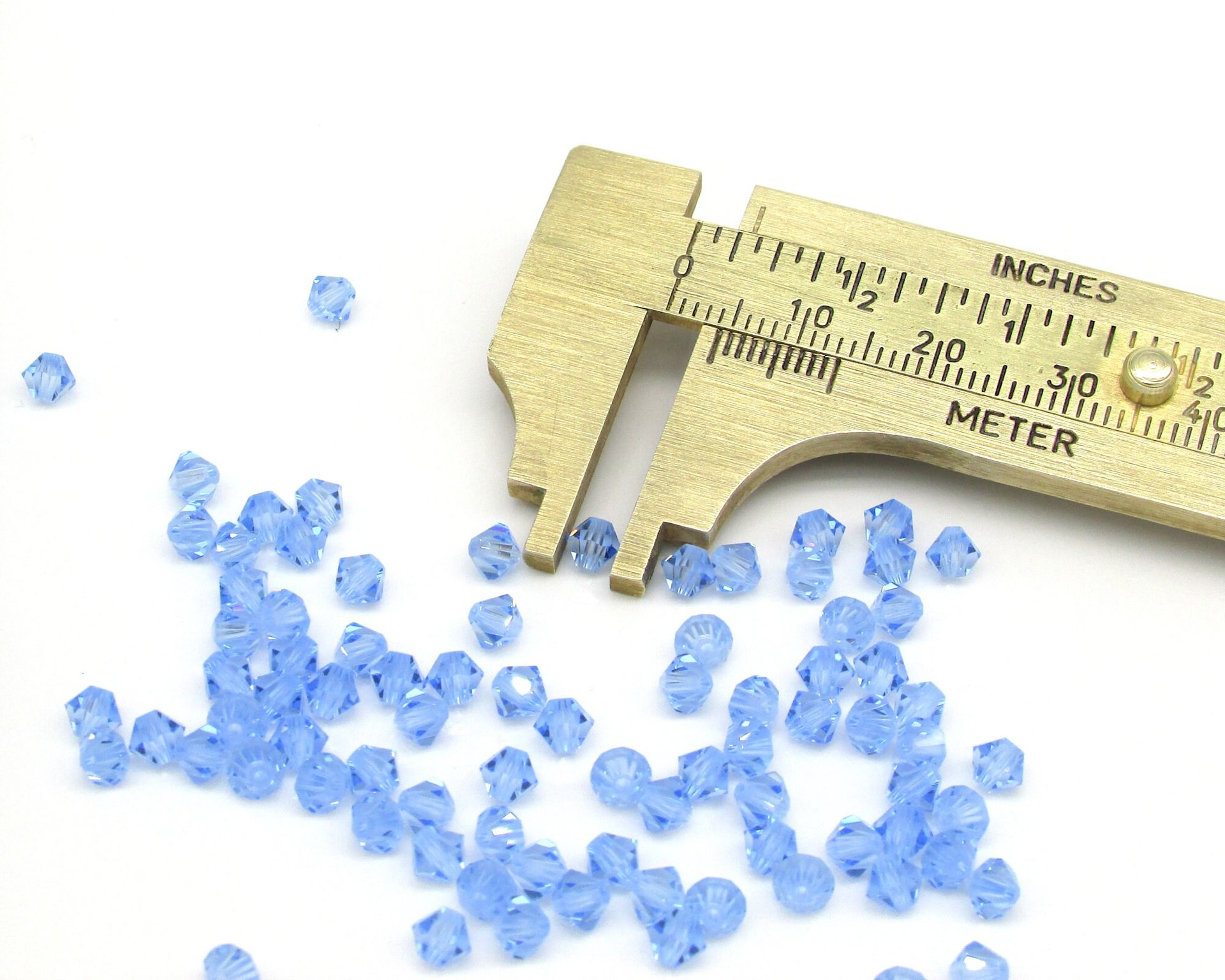 Vintage 4mm Bicone Beads, Light Sapphire Machine Cut Crystal Spacers