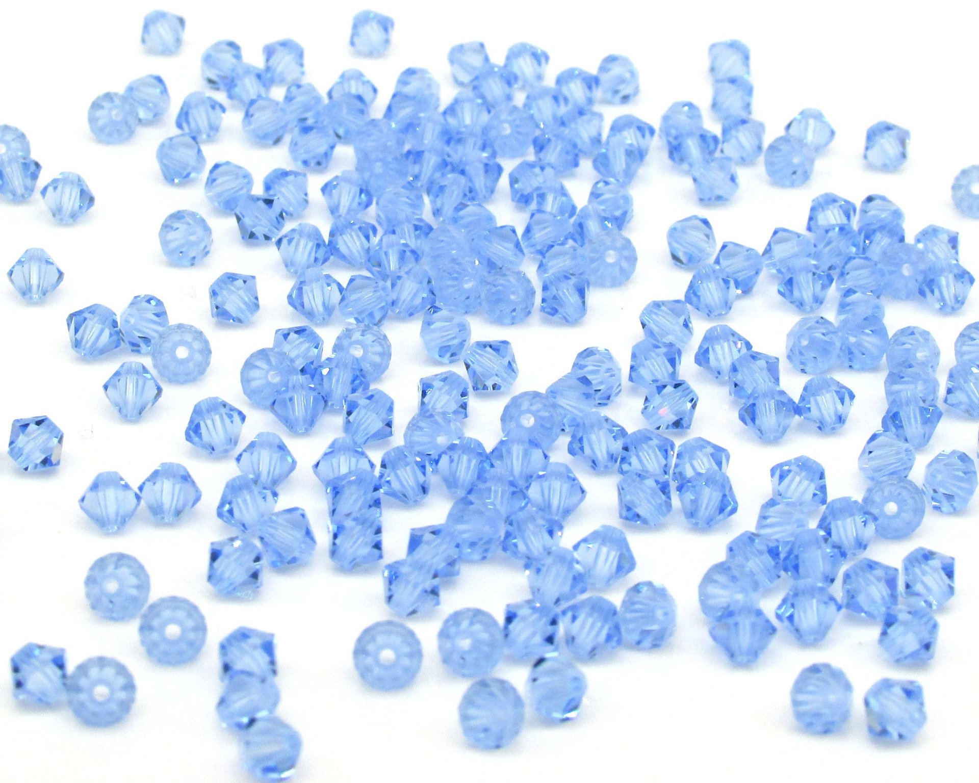 Vintage 4mm Bicone Beads, Light Sapphire Machine Cut Crystal Spacers