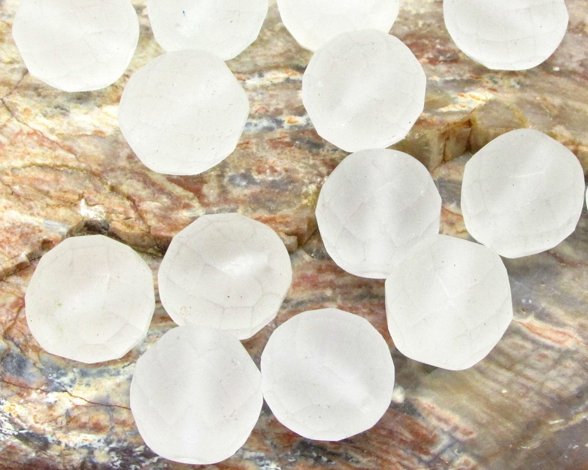 Frosted crystal beads measure 12mm round with 1mm center drilled holes.