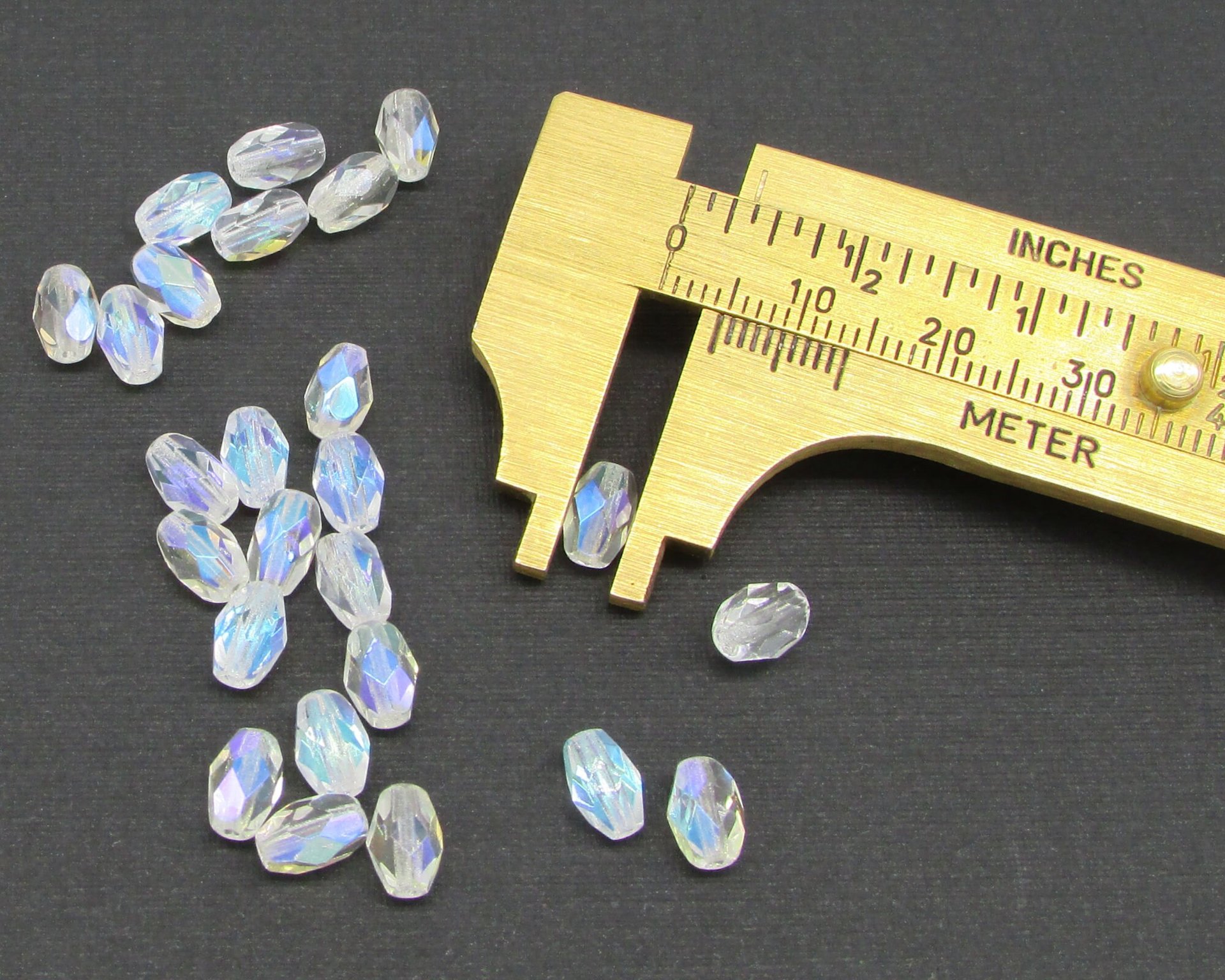 7x5mm Faceted Oval Barrels, Crystal AB Fire Polished Czech Glass Beads