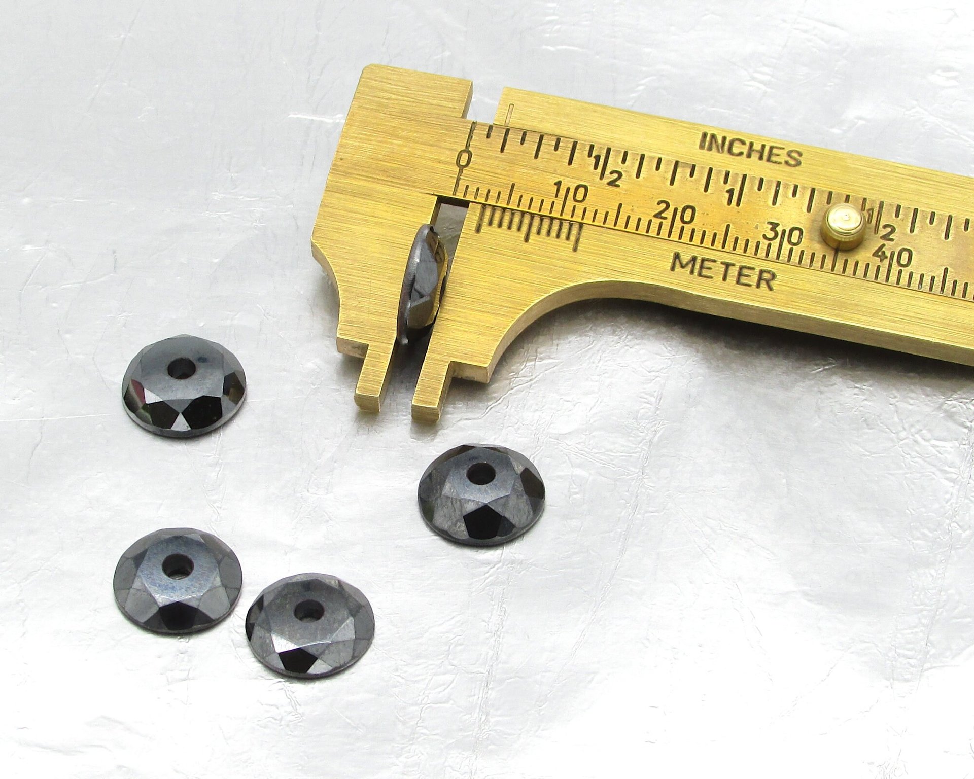 Hematite 11mm Round Faceted Cabochons with Center Hole