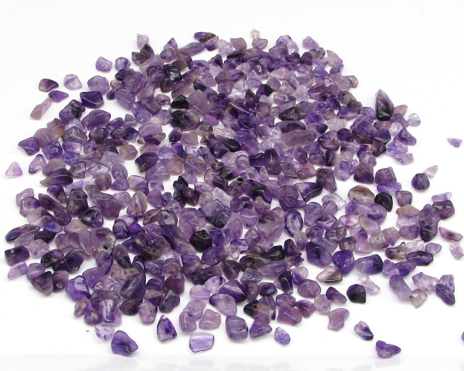 Polished amethyst beads are irregular gemstone nuggets measuring 3mm to 8mm long, with 0.8mm holes.