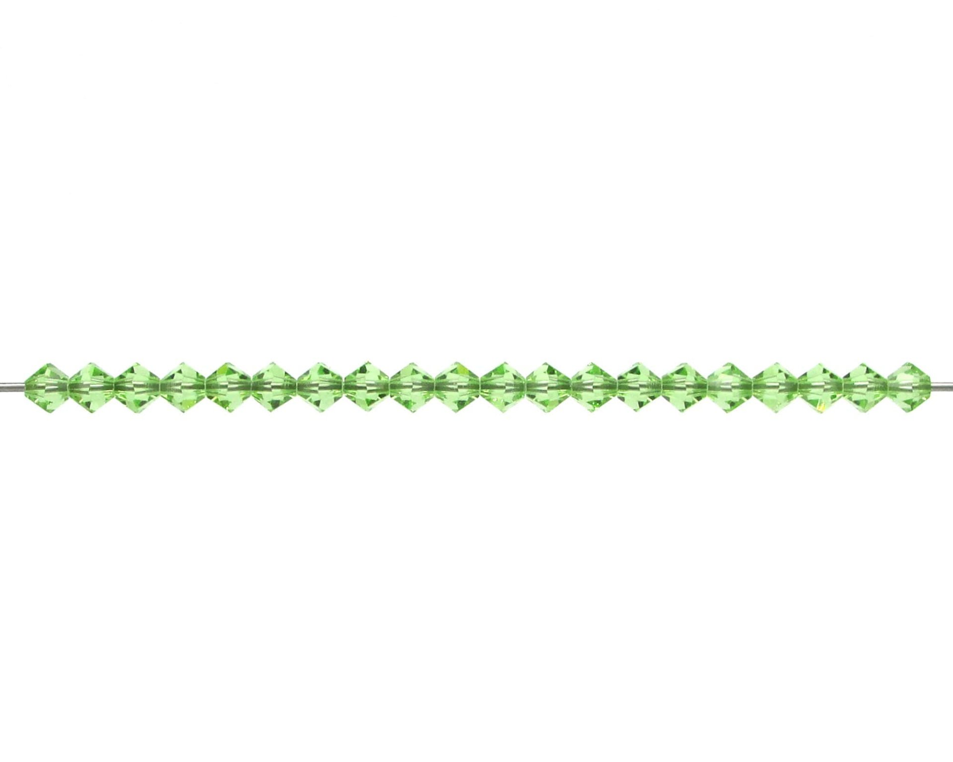 Small 4mm peridot green faceted crystal bicone beads are pointed at each end and have a hole size of approximately 0.6mm. 