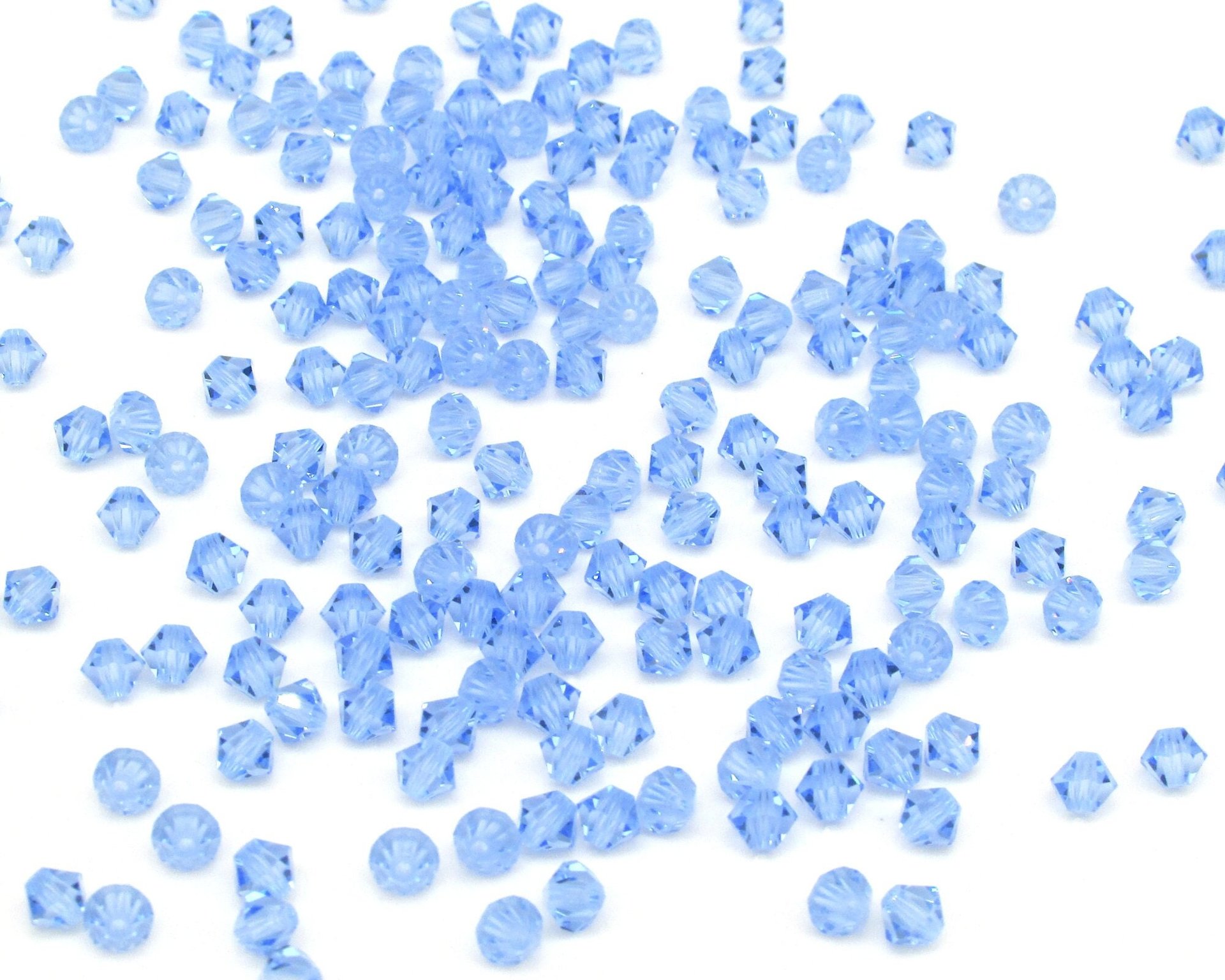 Vintage 4mm Bicone Beads, Light Sapphire Machine Cut Crystal Spacers